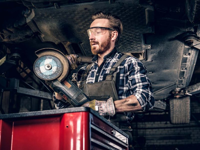 mechanic-in-protective-googles-holds-angle-grinder-small.jpg